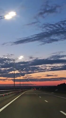 Evening highway drive captured near Shali, Russia at sunset