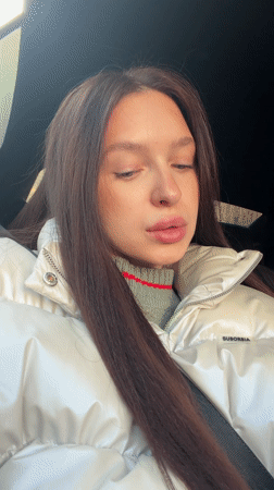 Woman in striped sweater documented by witnesses in Moscow