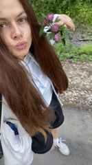 Afternoon walk through birch park in Zarechny, flowers in hand