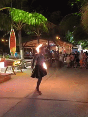 Fire performers light up a Nha Trang beach venue at night