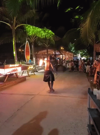 Fire performers light up a Nha Trang beach venue at night