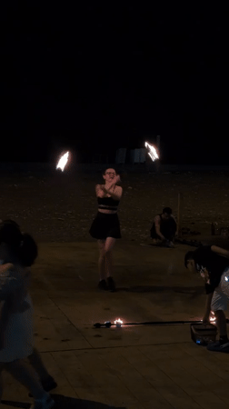 Fire performers light up Batumi's seafront on a summer night