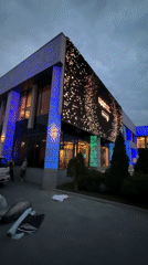 Moscow building glows at dusk with colorful lights and LED display