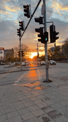 Evening traffic waits at Varna intersection during sunset