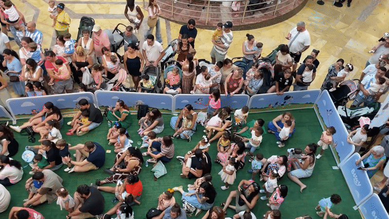 Málaga afternoon: shopping center event, street life, and retail browsing