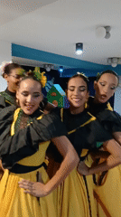 Venezuelan folk dancers rehearse in traditional costumes at Playa El Agua