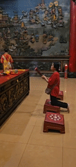 Evening worship observed at illuminated Chinese temple in Denpasar