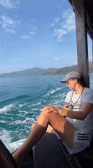Two women travel by motorboat near Nha Trang coastline