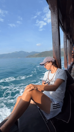 Two women travel by motorboat near Nha Trang coastline