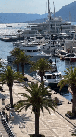 Marina activity documented in Tivat, Montenegro during sunny afternoon