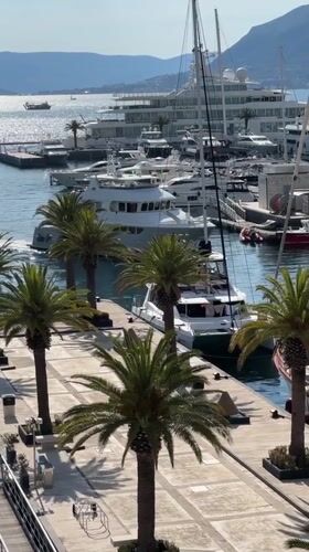 Marina activity documented in Tivat, Montenegro during sunny afternoon