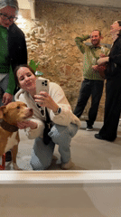 Barcelona evening captures woman with dog, grape-costumed pair