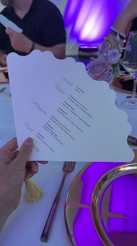Elegant gala dinner in Munich with purple lighting and formal table settings