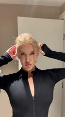 Woman takes selfies in indoor Belgrade setting