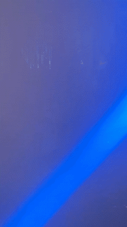 Blue laser lights illuminate smoky room in Almaty