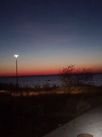 Tallinn coastline transitions from sunset to night