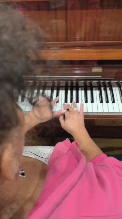 Hands on piano keys, both working simultaneously in Hrodna