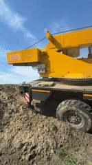 Crane truck stuck in mud in Tyumen, Russia