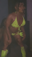 Woman dances in green bikini at Kamazo nightclub venue