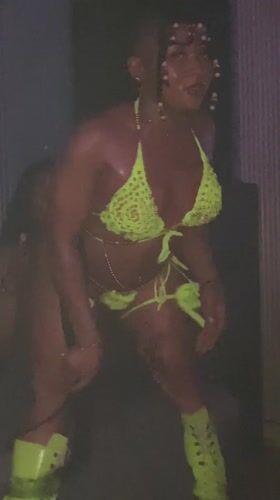 Woman dances in green bikini at Kamazo nightclub venue