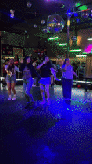 Young women dance at Lima nightclub