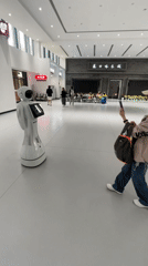 Service robot displays weather, animated eyes in Beijing district lobby