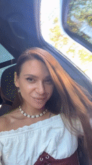 Woman documents coastal road trip with selfies and scenic stops