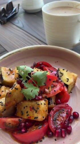 Riverside meal documented in Nizhnekayancha featuring eggplant and scenic views