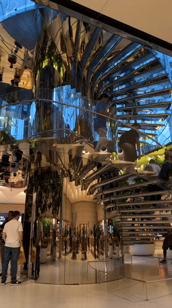 Modern NYC retail store interior with spiral staircase documented