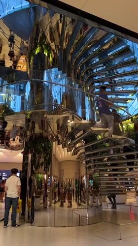 Modern NYC retail store interior with spiral staircase documented