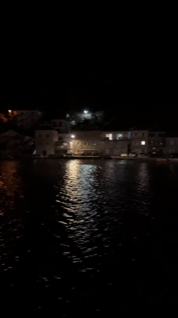 Night ferry crossing captured in Bay of Kotor, Montenegro