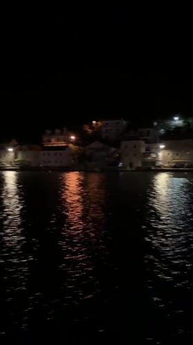 Night ferry crossing captured in Bay of Kotor, Montenegro