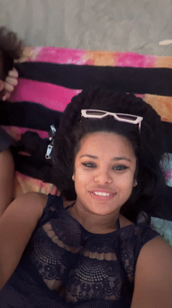 Beachgoers relax and stroll at Arambol Beach, India