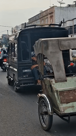 Roadside pause on a utility vehicle in Lhokseumawe