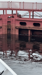Ship navigates the Svir River lock system at Svirstroy