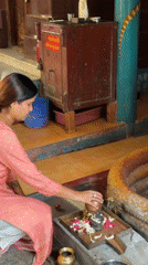 Woman performs water ritual at Hindu temple in Bengaluru