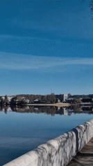 Woman visits waterfront monument area in Otchor, Russia