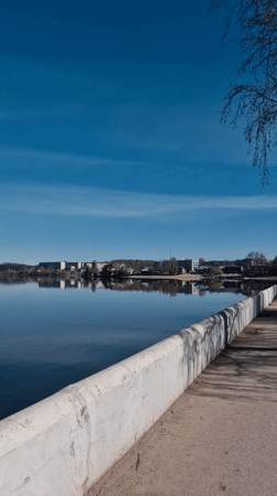 Woman visits waterfront monument area in Otchor, Russia