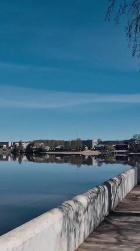 Woman visits waterfront monument area in Otchor, Russia