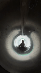 Inside a metal tube slide at a Khimki playground