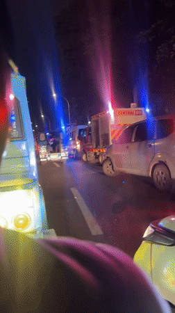 Nighttime traffic backup in Davao City with emergency vehicles present
