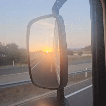 Truck driver captures golden sunrise highway view near Estaràs