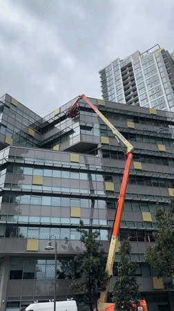Aerial lift work underway on New Westminster high-rises