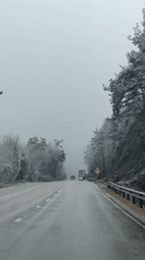 Vehicle travels snowy road in Lagerite, Bulgaria