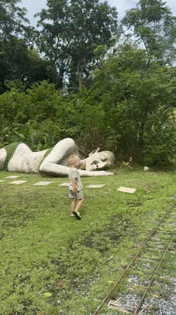 Visitors explore animal park with sculptures in Pa Khlok