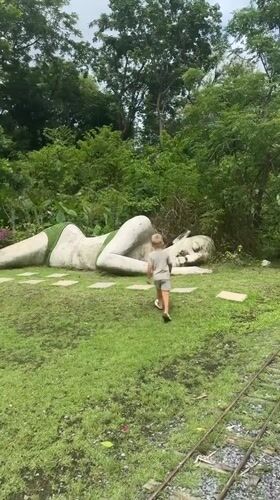 Visitors explore animal park with sculptures in Pa Khlok