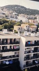 Evening aerial views capture residential Barcelona coastal neighborhoods