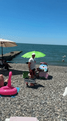 Crowded summer day on Sochi's Black Sea pebble beaches