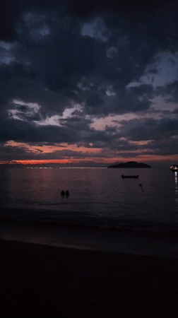 Dramatic sunset captured at Búzios beach during evening hours