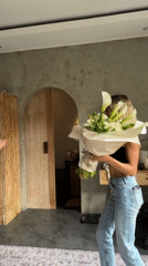 Women exchange flowers in intimate moment, North Kuta